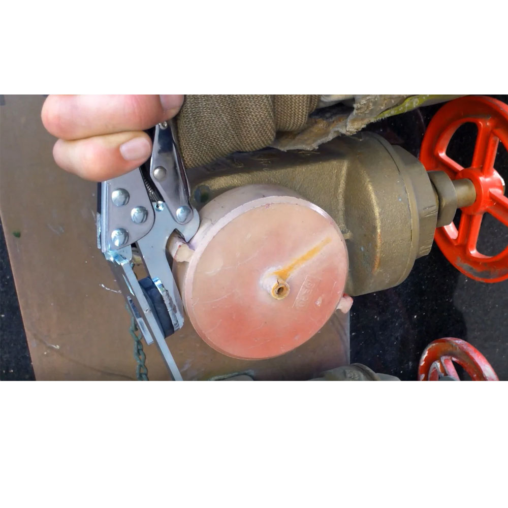 Quickstop Sprinkler Shut Off Multi-Tool in Use